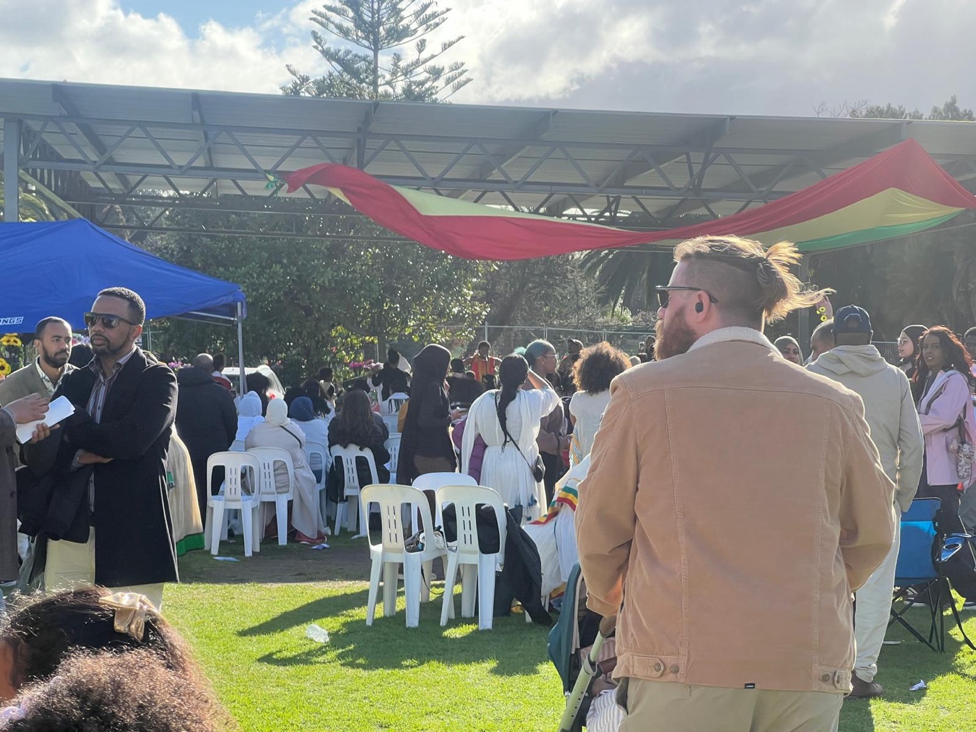The celebration stage draped in the green, yellow and red of the Ethiopian flag